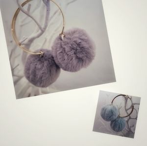 Two sets of large faux pum pum Sweater accessories